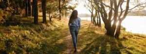 girl walking by lake